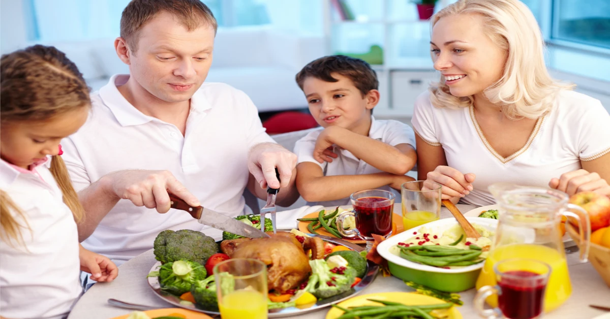 Holiday Survival Guide family eating at a table