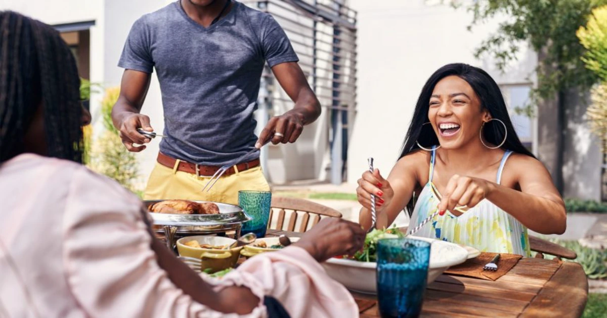 a picture of a family eating at a table